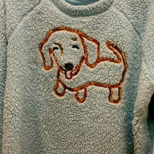 Light blue with a dog on front